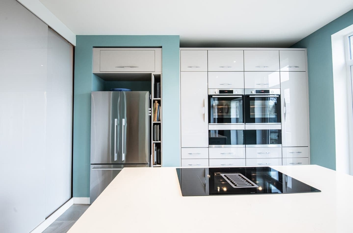 Kitchen with Teal Feature Wall