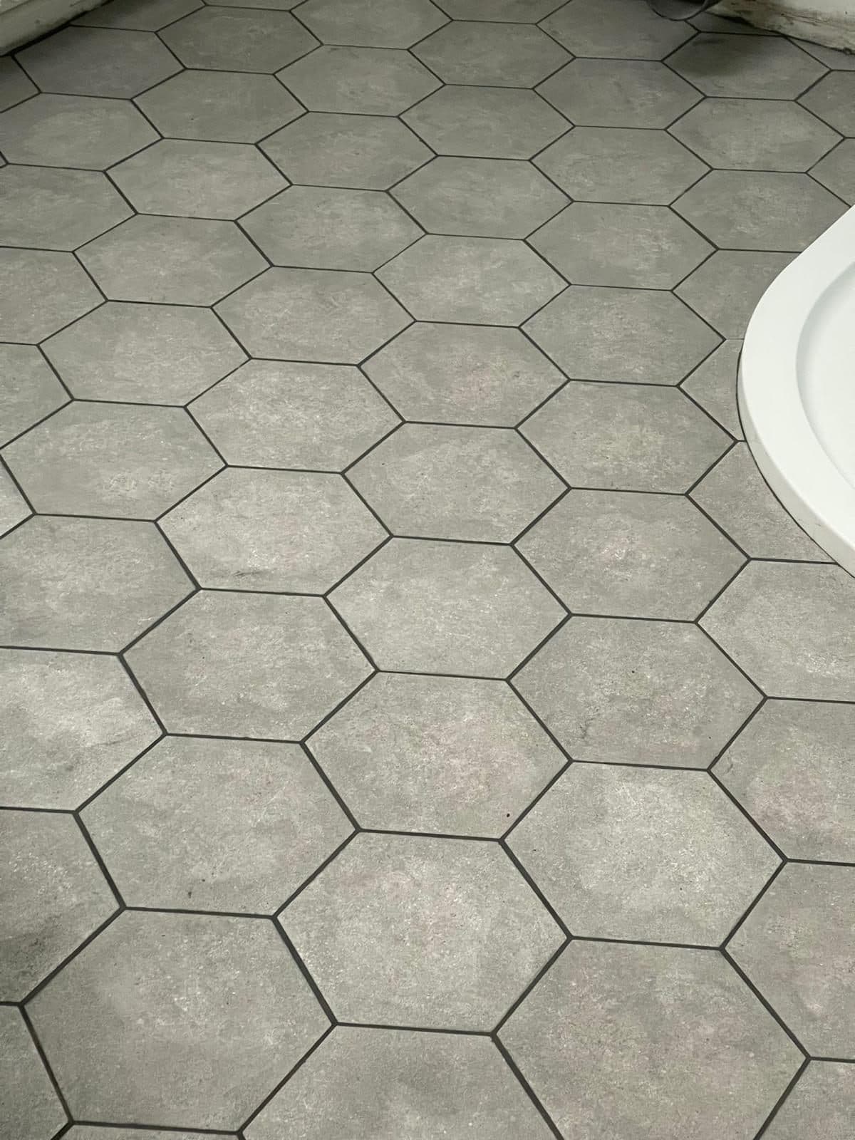Finished marble-effect tiled floor in a UK home renovation — project example 3