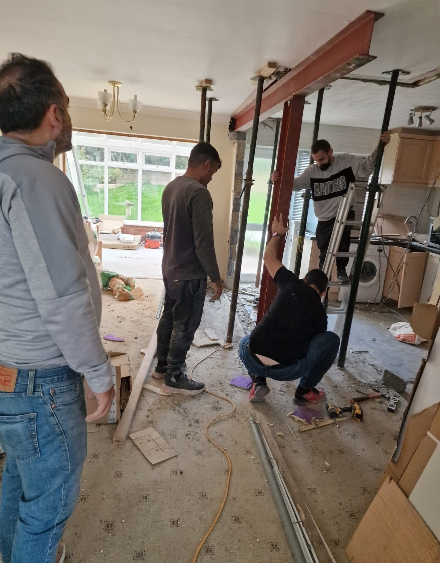 Bi-fold glazed doors being installed on a house extension