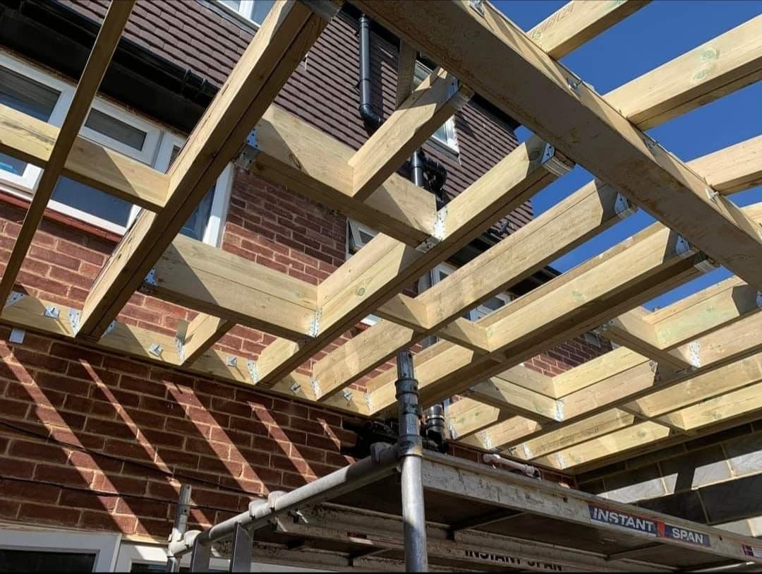 Roof trusses under construction on a UK house extension — project example 1