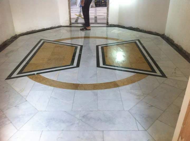 Finished marble-effect tiled floor in a UK home renovation — project example 1