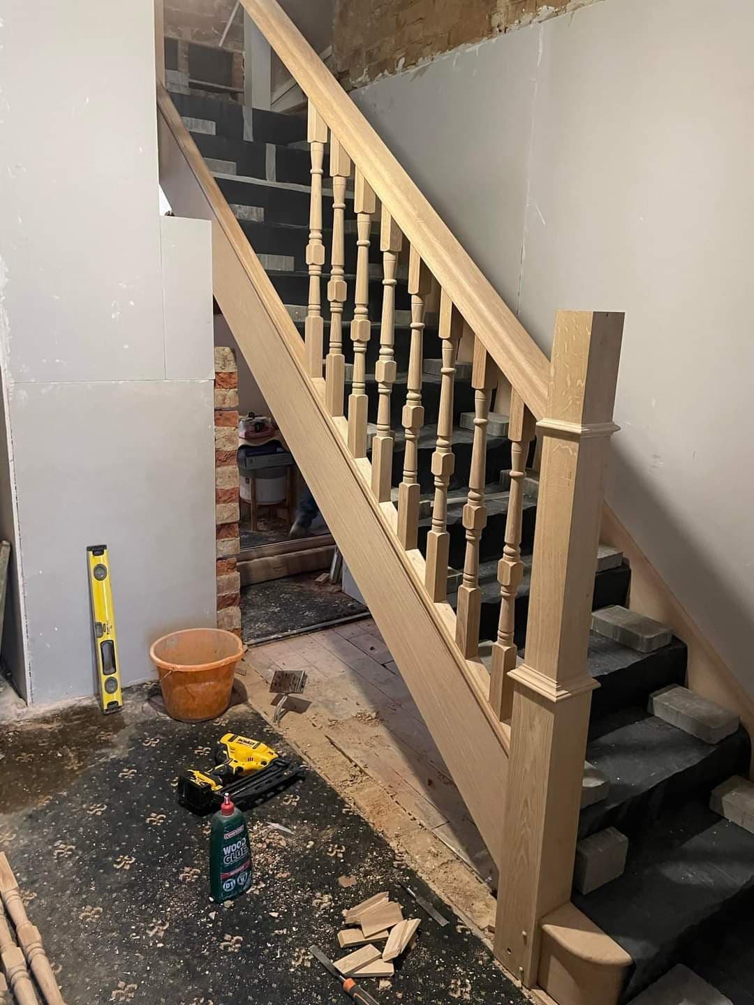 Bespoke oak staircase with turned spindles, fitted as part of a joinery project — project example 2