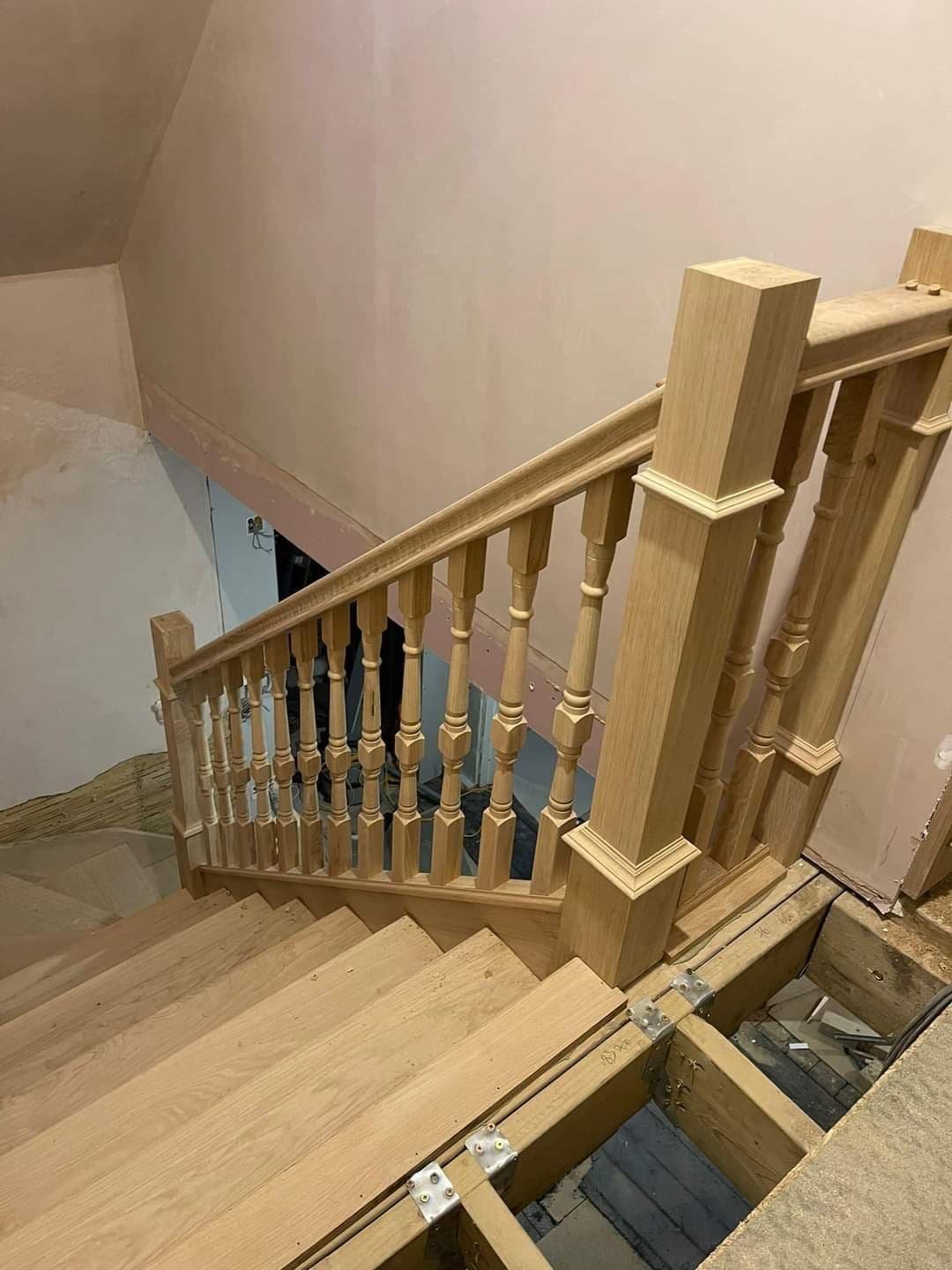 Bespoke oak staircase with turned spindles, fitted as part of a joinery project — project example 1