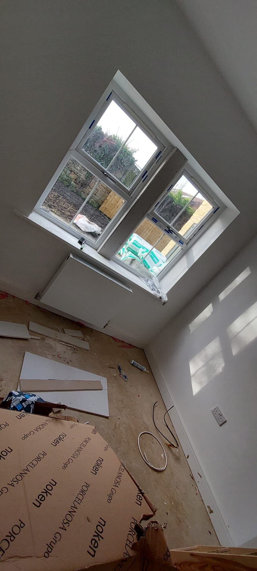 Bi-fold glazed doors being installed on a house extension — project example 1