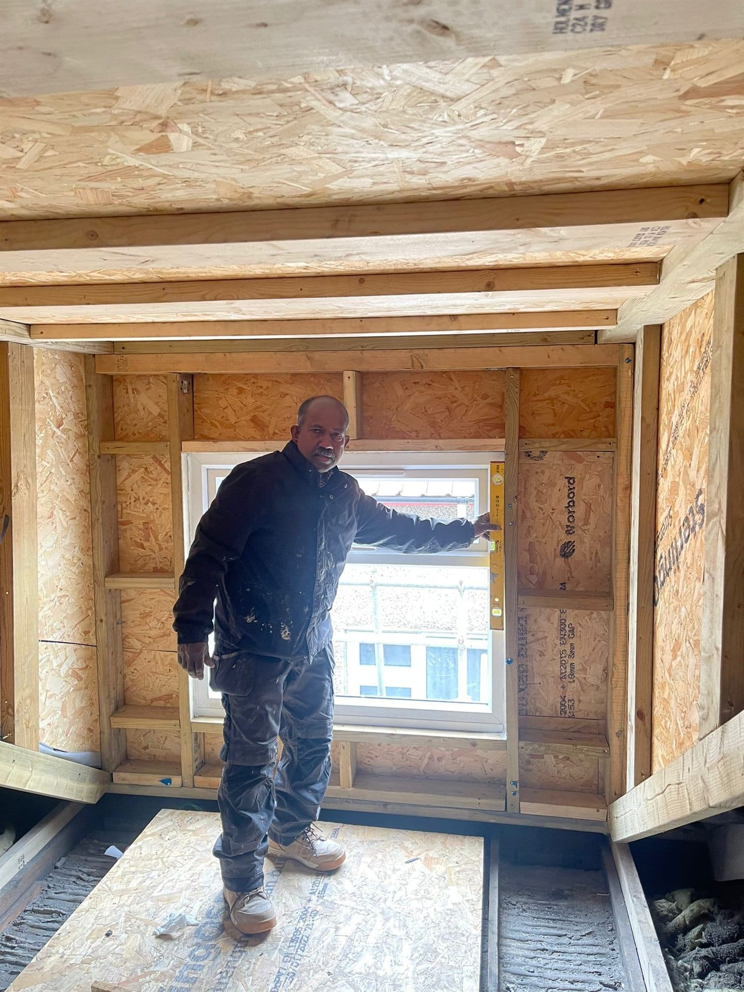Finished loft conversion bedroom with roof windows in a UK home — project example 2