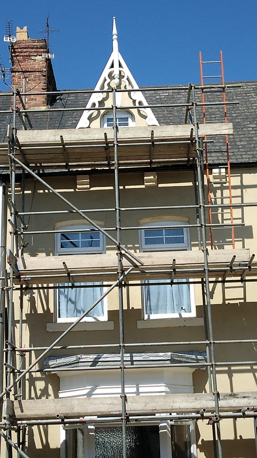 Finished natural slate roof with chimney on a UK home — project example 3